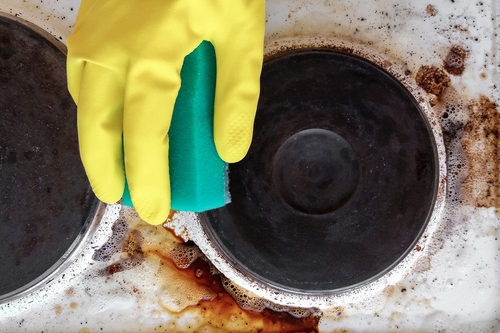 Hand,In,Household,Glove,Cleaning,Grease,And,Dirt,From,Kitchen